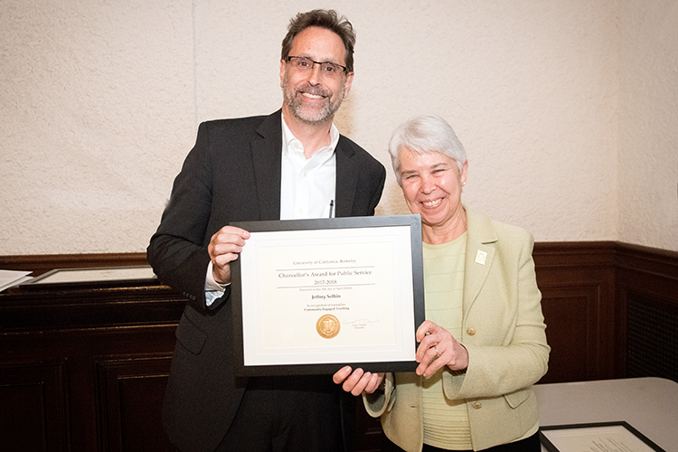 Jeff Selbin, a professor at Berkeley Law, stands with Chancellor Carol Christ.