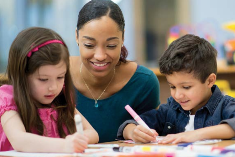 a teacher working with two 4-year-olds