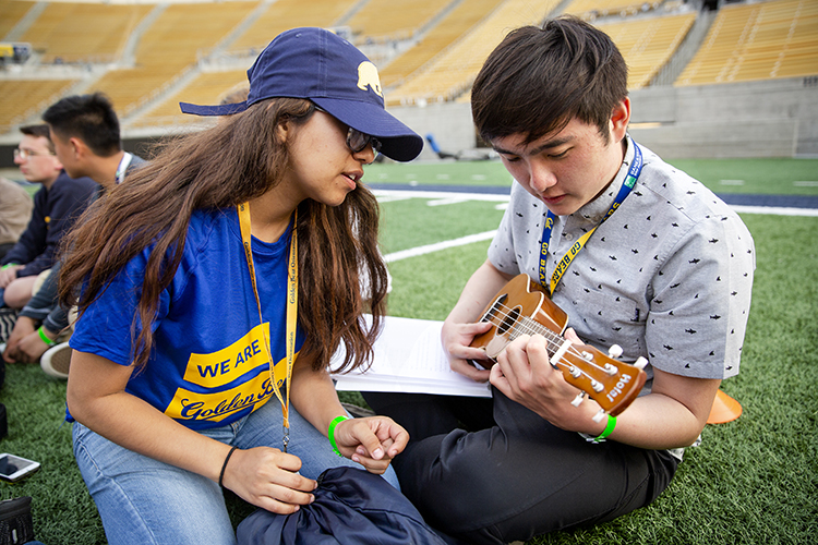 new student learns to play a banjo