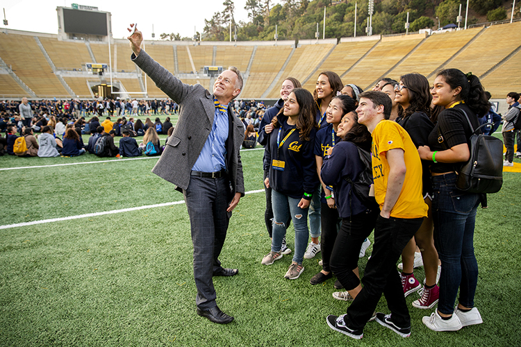 joseph greenwell takes a selfie with new students smiling