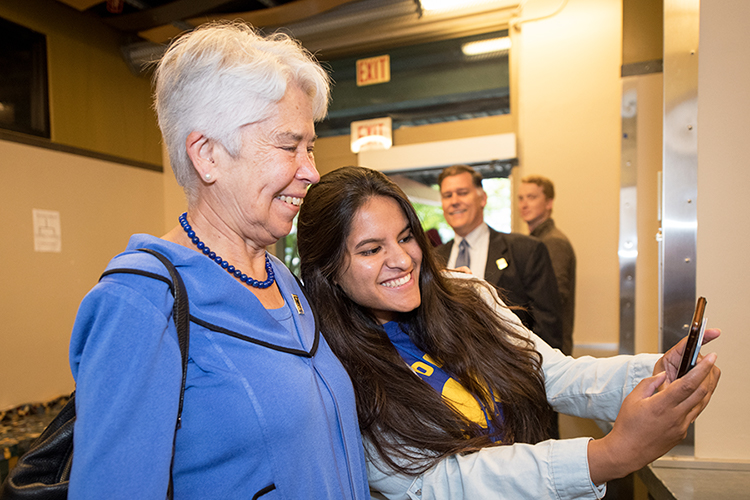 New Berkeley student takes a selfie with Chancellor Carol Christ