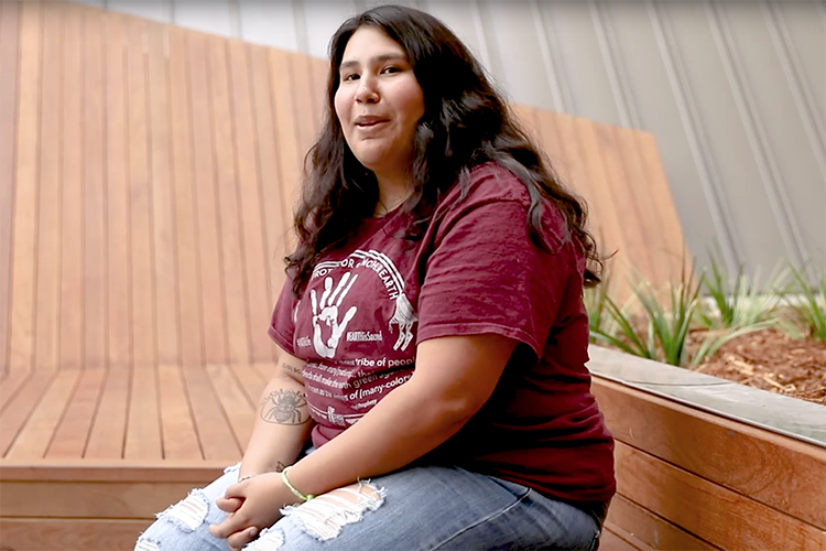 a student in a red tshirt