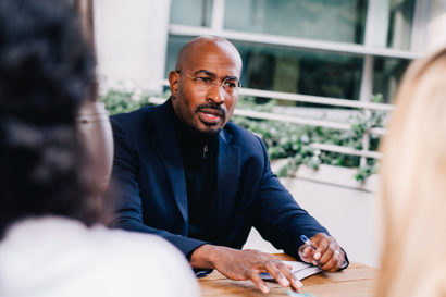 Van Jones talking to people at a table