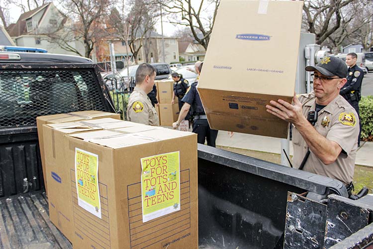 a man puts a box in a truck