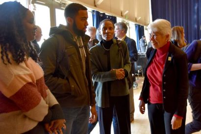 a woman talks with a group