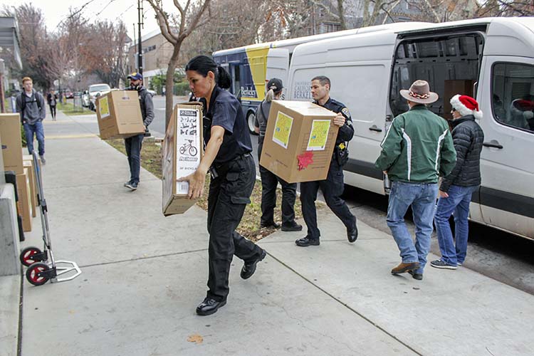 a woman hauls a box