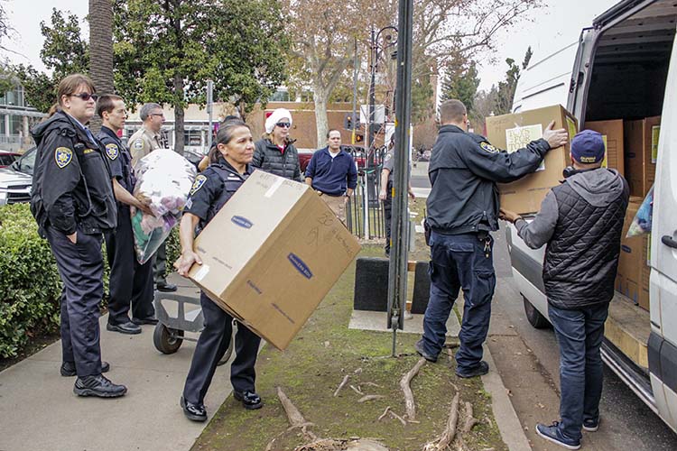 a woman lifts a box