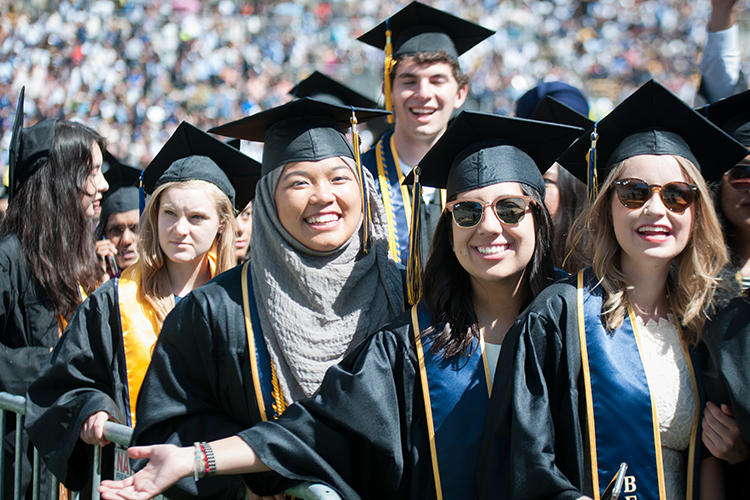 graduating seniors smiling and walking