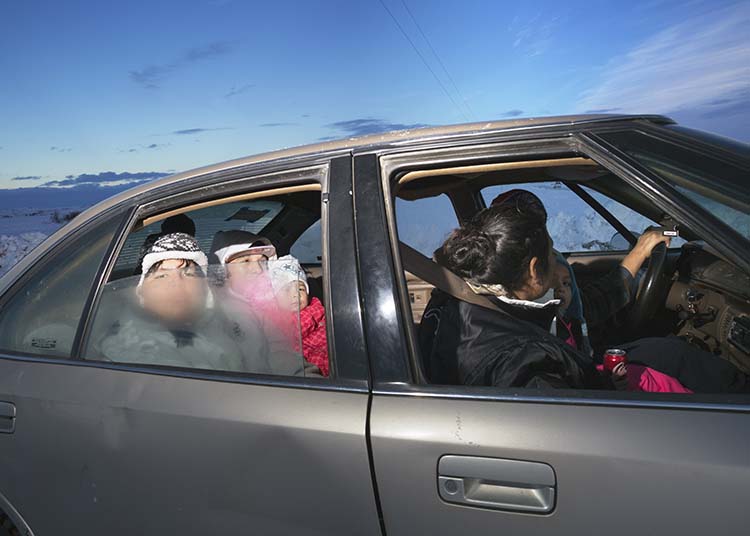 people sit in a car with fogged windows