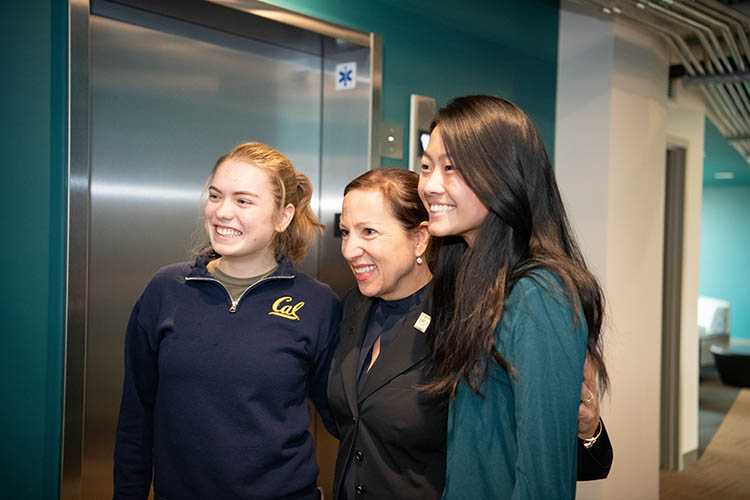 three women pose for a picture