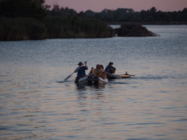 A.J. White and fellow researchers on lake in Cahokia Mounds State Historic Site in Illinois where they collect ancient mud samples. (Photo by Jeffery Stone)
