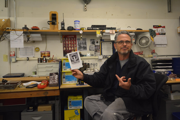 Jeff Bovie holds flier about the Emma Goldman Papers project