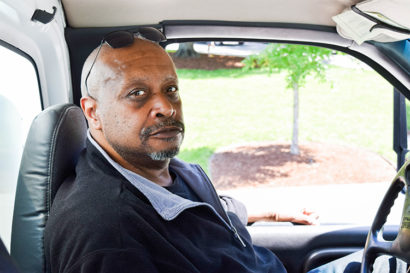 portrait of jim hanspard sitting in his truck