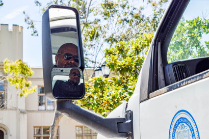 Jim Hanspard's face reflected in the side mirror