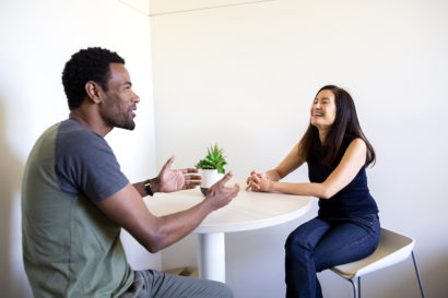 Lelisa and Professor Chen sitting at a table talking