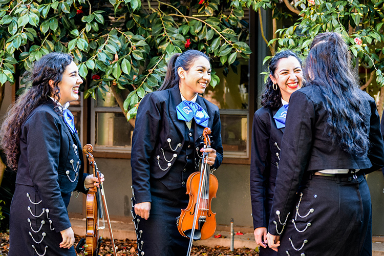 Four violinists are among the seven women in the 15- member mariachi.