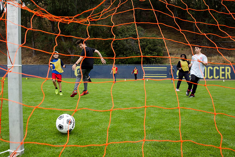 students play soccer 