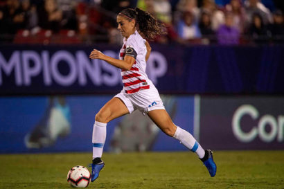 alex morgan kicks a ball