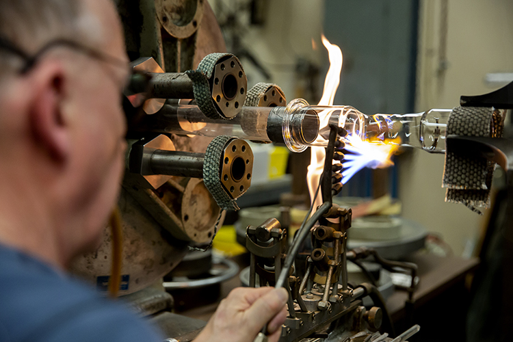 Jim Breen uses a fire-cutting tool in his shop