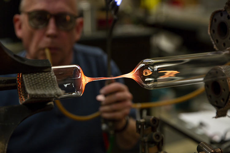 A tube of glass is separated by glassblower Jim Breen,
