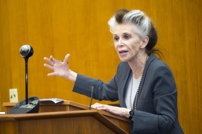 Catharine MacKinnon speaking at a podium