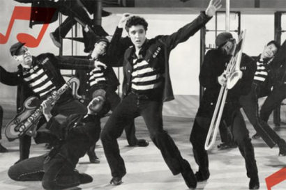 Elvis dancing with other dancers