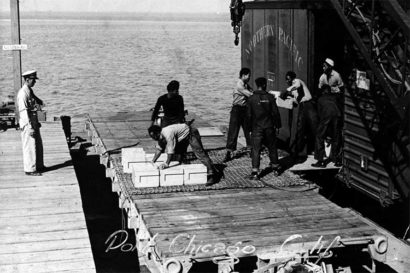 men load ammunition in a black-and-white photo