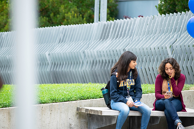 two people on a bench