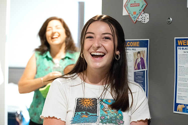 a student smiles at the camera