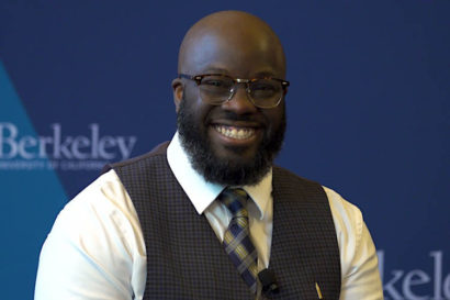 a man smiles at the camera