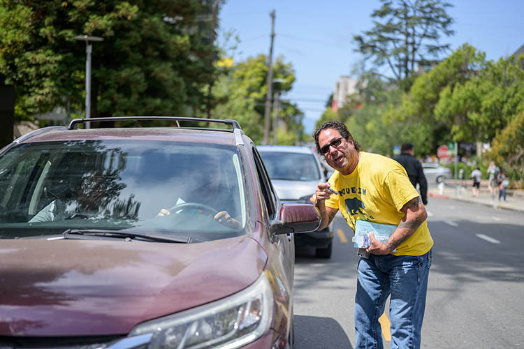 a man talks to a driver