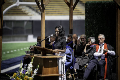 a student stands at a podium