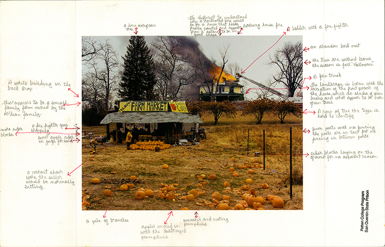 a farmer's market with pumpkins and a house burning in the background