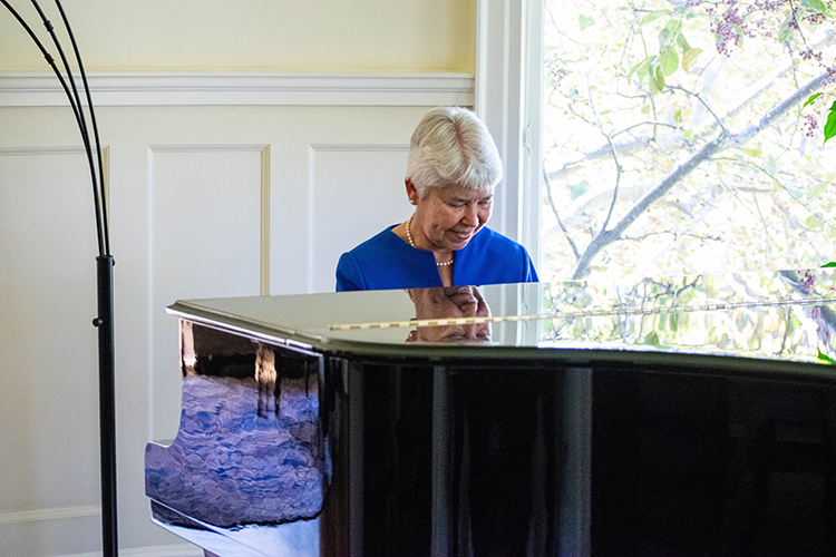 Chancellor Christ practices the piano