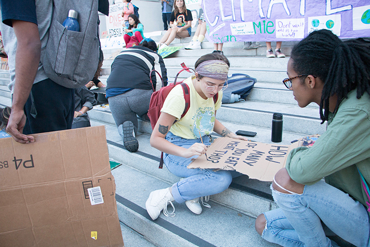 Berkeley students work on signs for climate strike