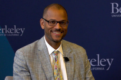 eugene whitlock smiles at the camera