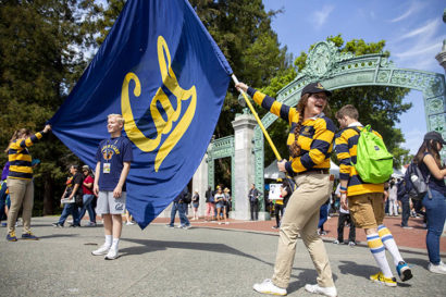 student waves cal flag