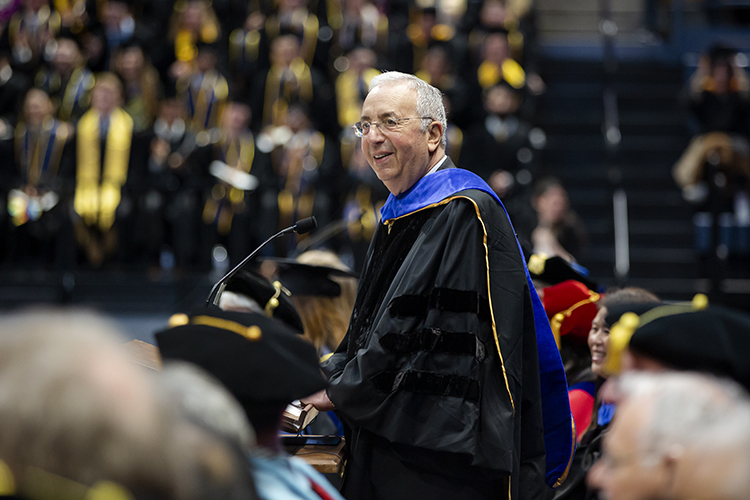 robert haas at the podium giving a speech