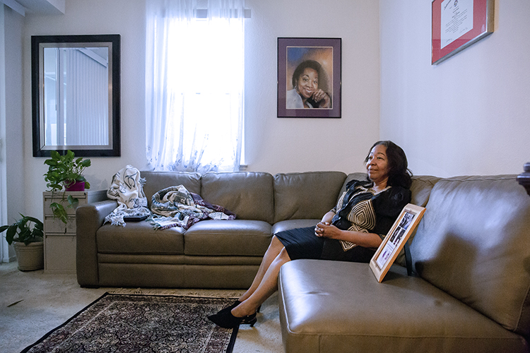 Lorrain Taylor sits in the living room of her home describing the devastating emotional impact of losing her twin sons twin sons, Albade and Obadiah, to a shooting in 2000, when they were 22-year-old college students.