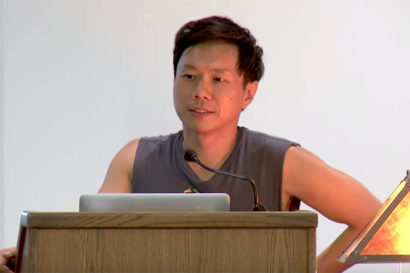 Paul Chan gives a lecture at a podium