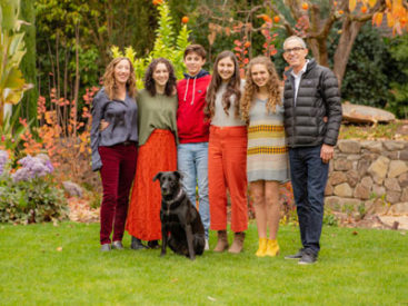 Carter stands with her family on a lawn