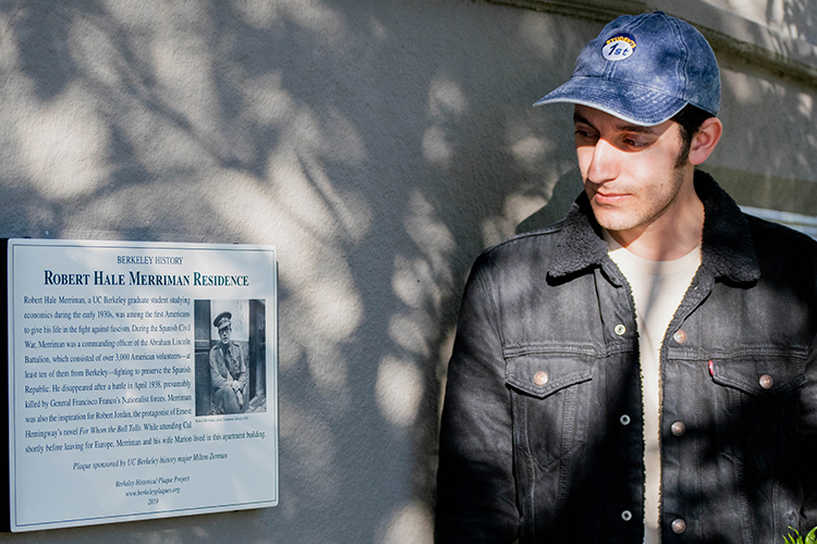 Student Milton Zerman looks at a plaque he sponsored for a Berkeley Ph.D. student who fought in the Spanish Civil War.