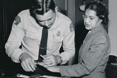Rosa Parks being fingerprinted after being arrested