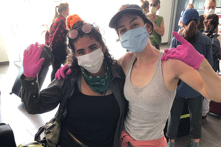 GIovanna Figueroa and Julie Tierney, two Ph.D. student who do research in Peru, reunite at the airport in Iquitos, Peru during the COVID-19 crisis.