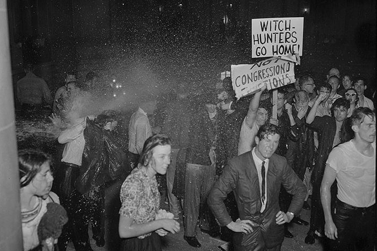 Students soaked after getting sprayed with firehouses at a protest