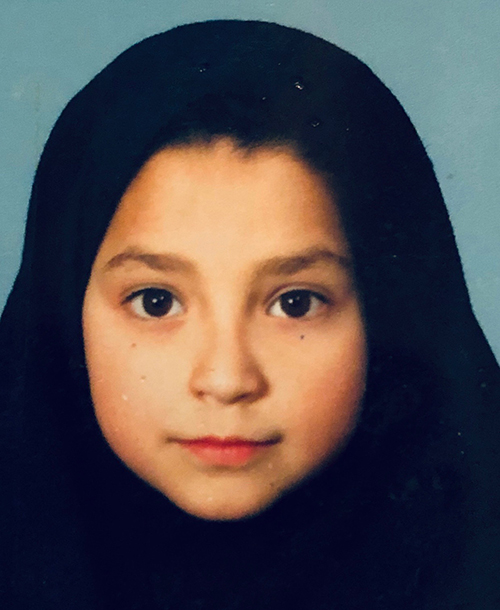 ID photo of Maryam at age 8 