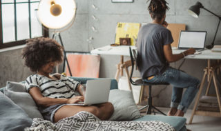 Couple working together in a room (iStockphoto)