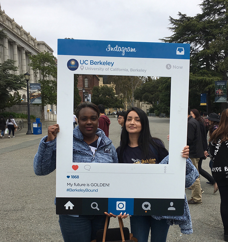 Aminah Elster and Daniela Medina pose in an instagram picture frame during welcome week.