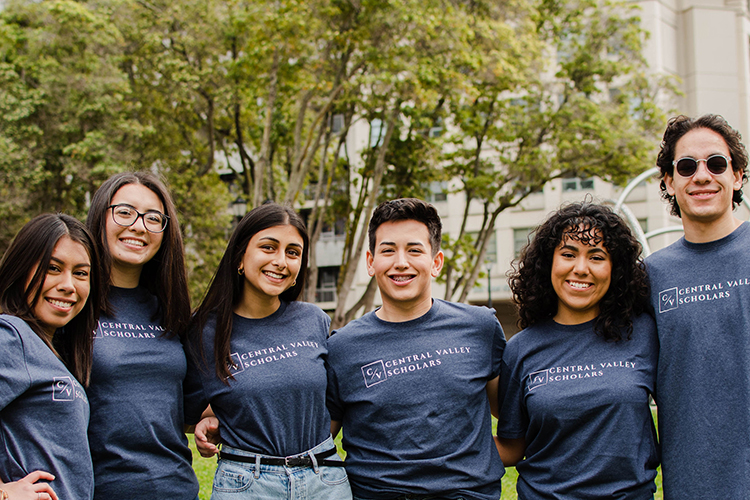 The Central Valley Scholars team, in matching t-shirts, stand with their arms around each other.