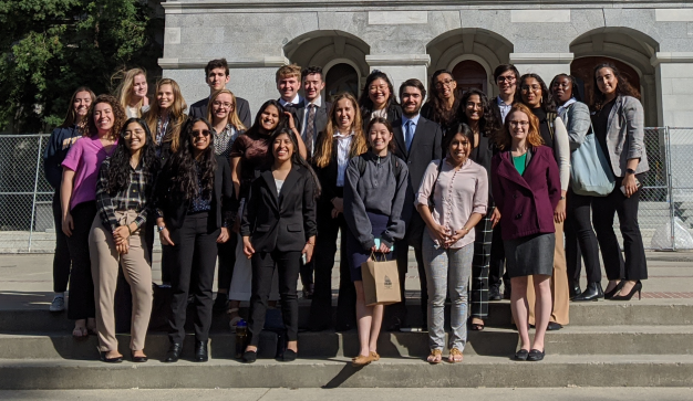 A group of Cal-in-Sacramento fellow formally pose in front of a state Capitol building on March 13, 2020, when they were visiting offices where they planned to have summer internships.